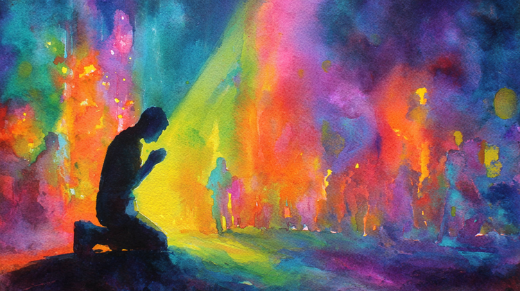 A man kneeling behind a worshipping crowd